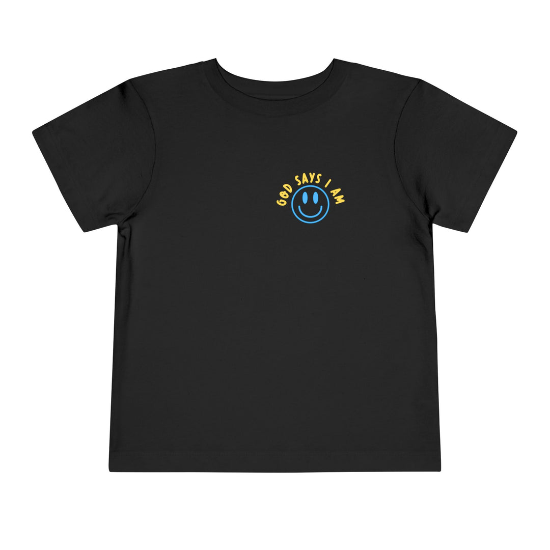 I AM Toddler Tee: Plain black with a blue smiley-face and “GOD SAYS I AM” in yellow. Made from soft Airlume cotton for comfort.