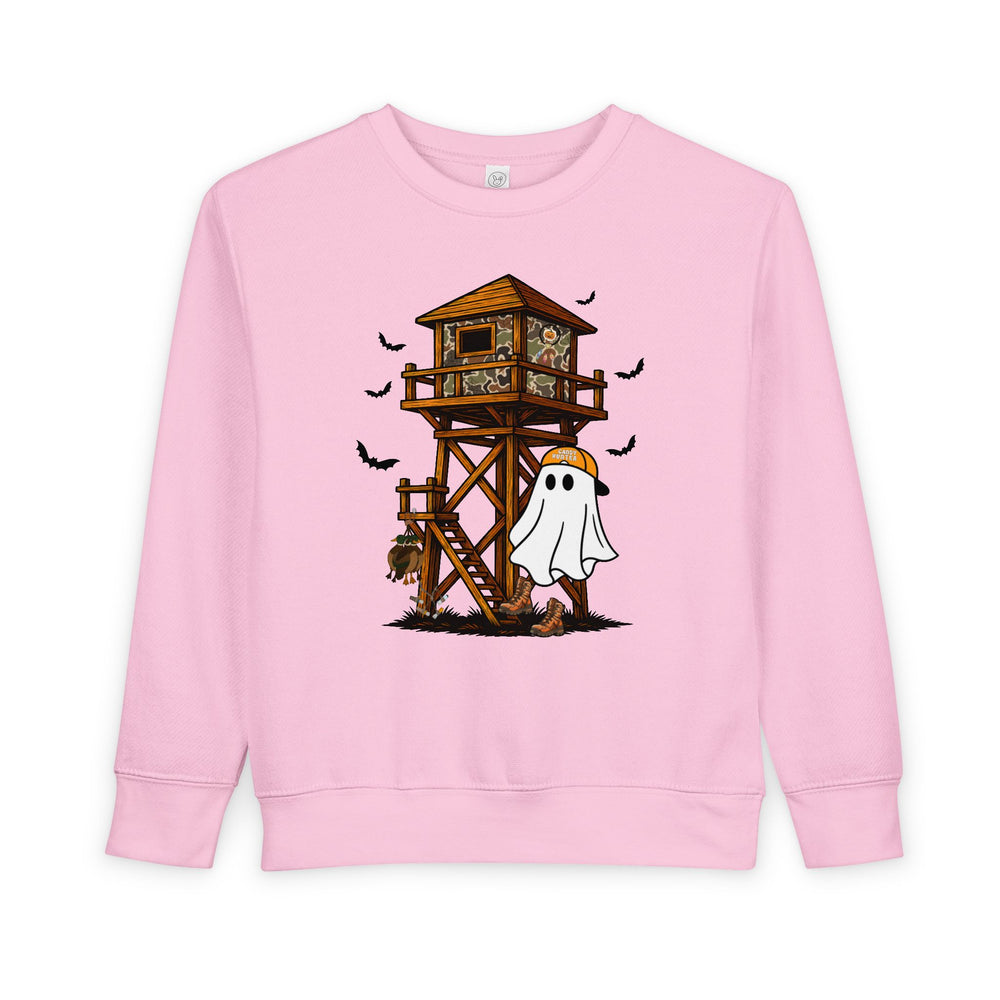 Ghost Hunter Toddler Crew: Light-pink sweatshirt featuring a playful Halloween scene with a ghost in a cap, hunting stand, and flying bats. Cozy, durable fleece blend.