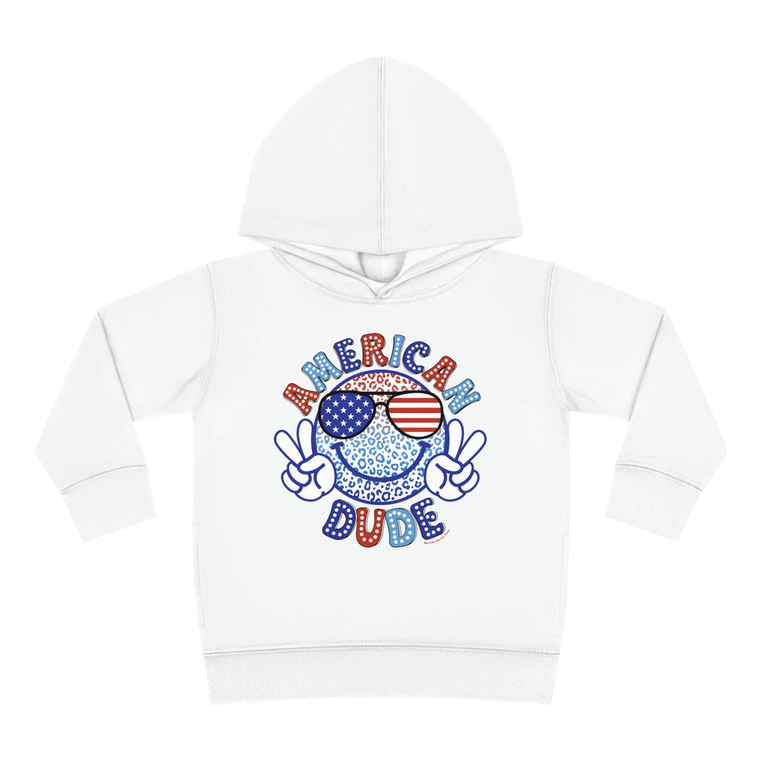 American Dude Toddler Hoodie featuring a smiley face with sunglasses on a white hoodie. Jersey-lined hood, cover-stitched details, and side seam pockets for durability and coziness. Ideal for toddlers.