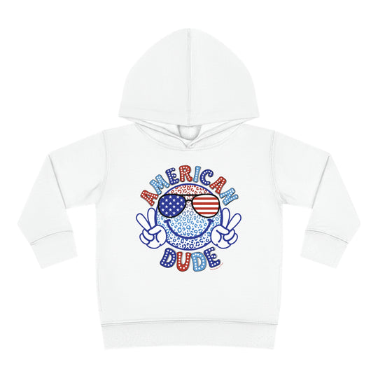 American Dude Toddler Hoodie featuring a smiley face with sunglasses on a white hoodie. Jersey-lined hood, cover-stitched details, and side seam pockets for durability and coziness. Ideal for toddlers.