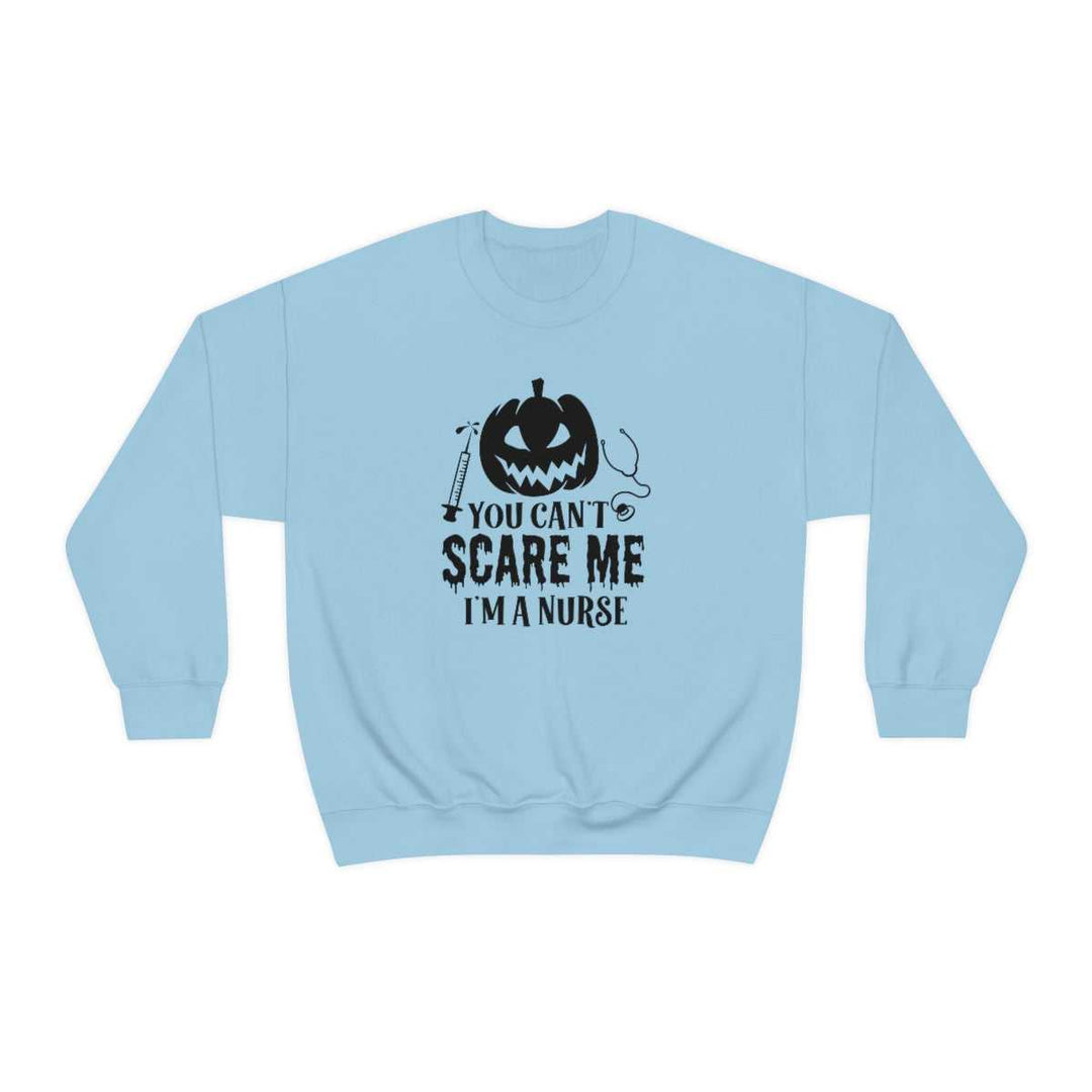 Unisex heavy blend crewneck sweatshirt featuring You Can't Scare a Nurse design with a pumpkin and stethoscope. Made of 50% cotton, 50% polyester, ribbed knit collar, and no itchy side seams. Sizes S-5XL.