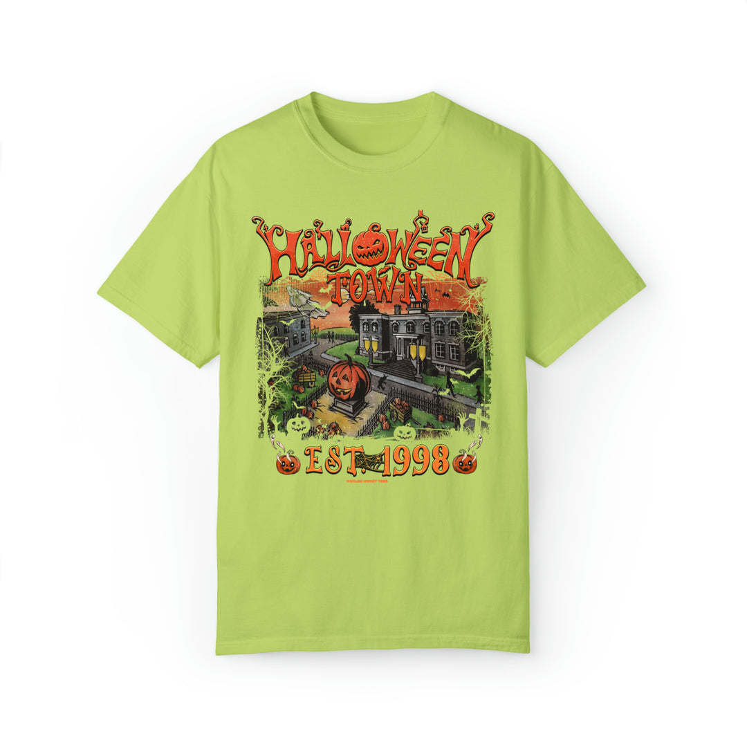 A green shirt featuring a graphic design of a pumpkin and a house, part of the Halloweentown Tee collection at Worlds Worst Tees. Unisex garment-dyed sweatshirt made of 80% ring-spun cotton and 20% polyester, with a relaxed fit and rolled-forward shoulder.