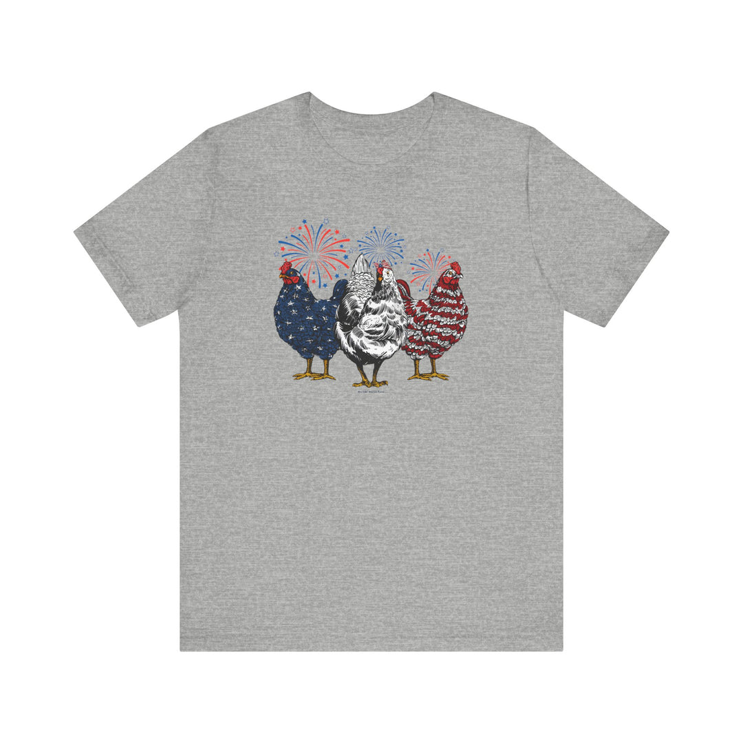 A grey t-shirt featuring a playful design of chickens and fireworks, part of the Chicken 4th Tee collection. Unisex jersey tee made of 100% Airlume combed cotton, with ribbed knit collars and taping for durability.