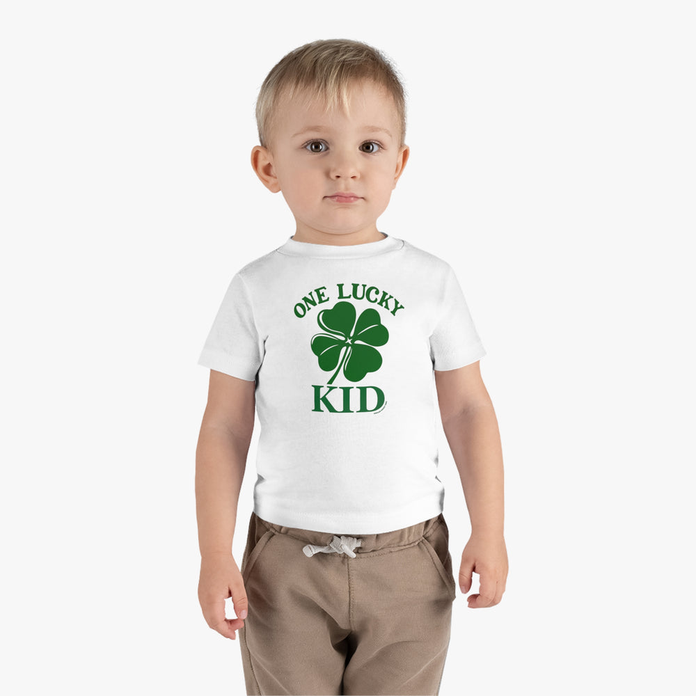 A toddler in a white tee with a four-leaf clover design. Comfortable cotton jersey with shoulder-to-shoulder taping, double-needle stitching, and Easy Tear™ label for no irritation. From 'Worlds Worst Tees'.