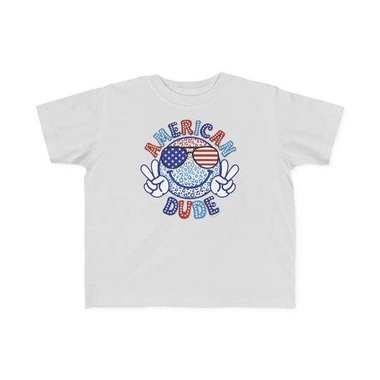 American Dude Toddler Tee featuring a cartoon character with sunglasses, a peace sign hand gesture, and a colorful background. Soft 100% combed ringspun cotton, light fabric, tear-away label, classic fit. Sizes 2T to 5-6T.