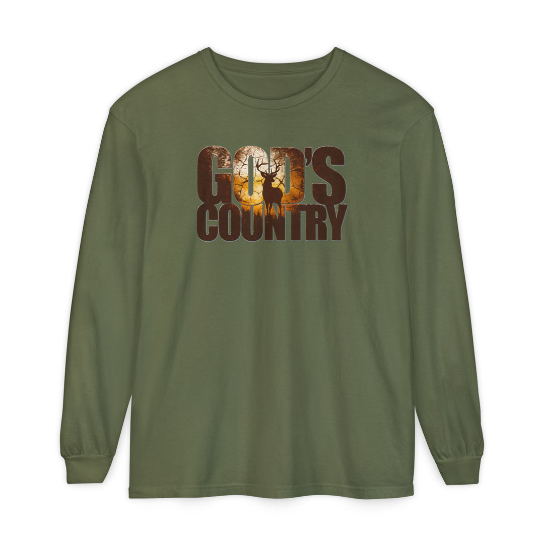 Forest-green long-sleeve tee with “GOD'S COUNTRY” and sunset woodland scene featuring a stag. Made of soft ring-spun cotton, offering a relaxed fit.