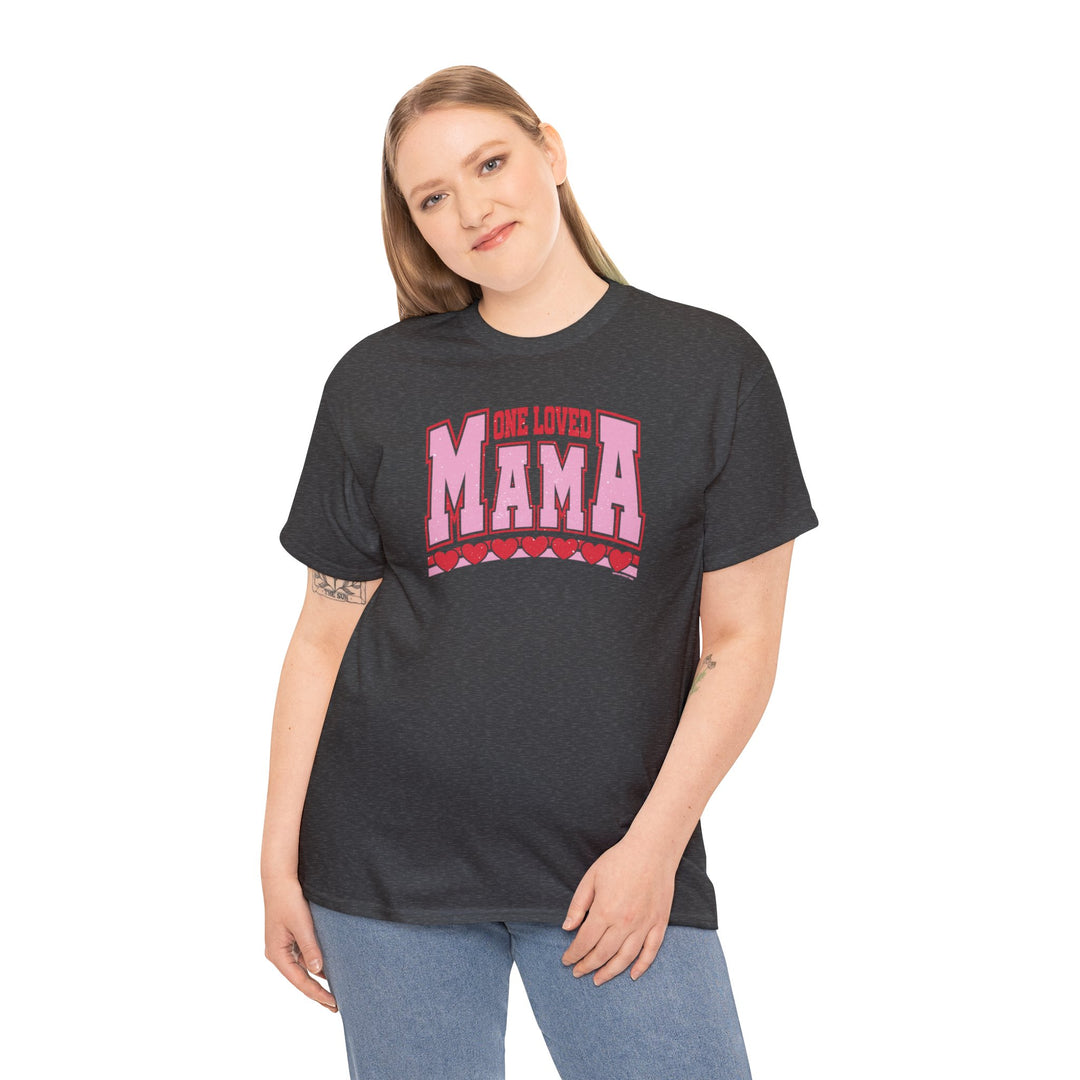 A woman in a black shirt poses, showcasing the One Loved Mama Tee. Unisex heavy cotton tee with no side seams, durable tape on shoulders, and ribbed knit collar. Classic fit, 100% cotton.