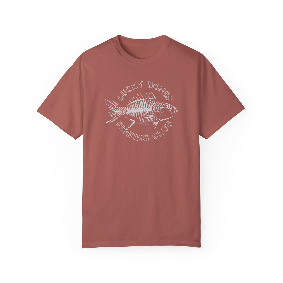 A red Lucky Bones Fishing Club Tee with a fish design on ring-spun cotton. Medium weight, relaxed fit, durable double-needle stitching, and seamless sides for comfort. From Worlds Worst Tees.