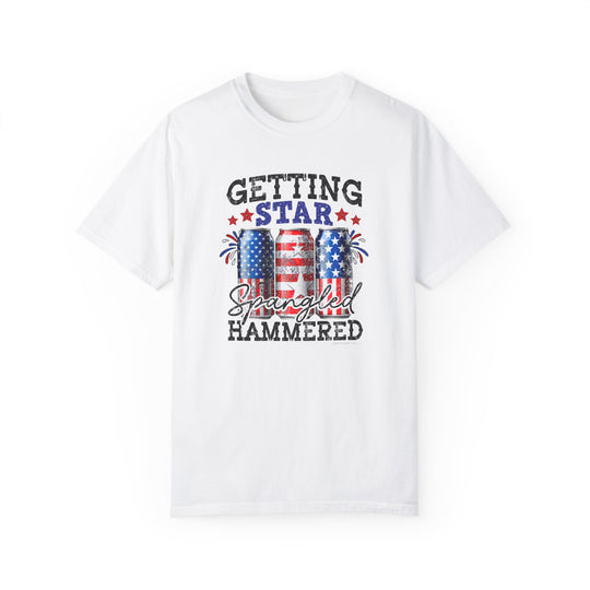 A white Star Spangled Hammered Tee with a graphic design of red, white, and blue cans with stars and stripes. 100% ring-spun cotton, medium weight, relaxed fit, durable double-needle stitching, and seamless sides for a tubular shape.