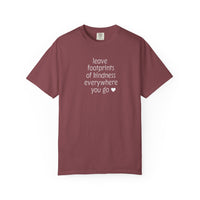 Muted maroon Leave Kindness Tee with white text and heart on chest, short-sleeved, crewneck, laid flat. Features Comfort Colors brand tag.