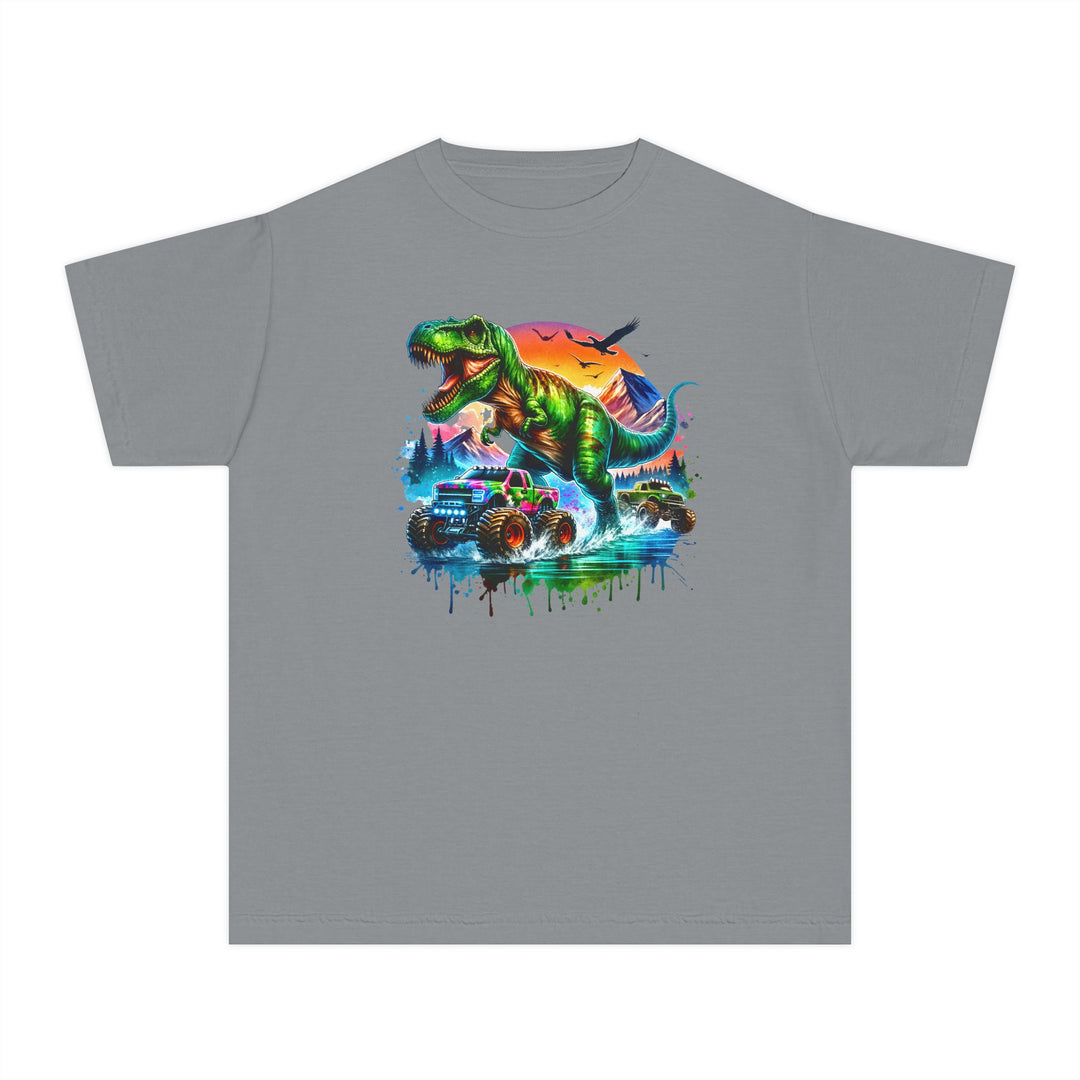 Dino Truck Kids Tee featuring a dynamic graphic of a green T-Rex and colorful monster trucks splashing through water, set against a stylized sunset backdrop.