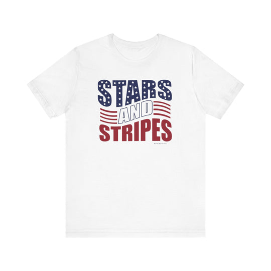 A white t-shirt featuring red and blue text, stars, and a flag logo. Unisex jersey tee with ribbed knit collars, 100% Airlume combed cotton, retail fit, tear away label, and quality print.