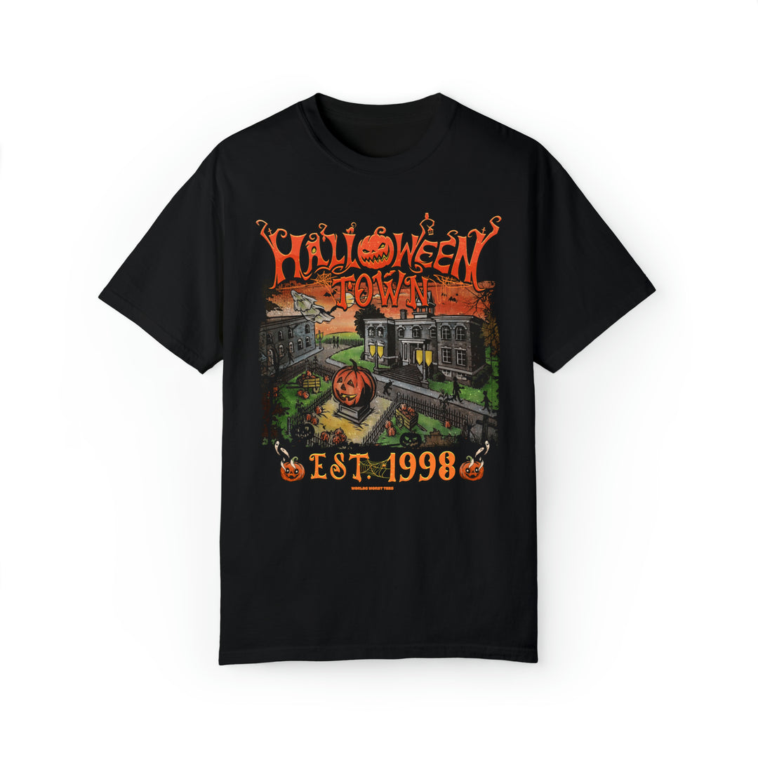 A Halloweentown Tee, black shirt with a graphic pumpkin design, made of 80% ring-spun cotton and 20% polyester. Unisex, garment-dyed sweatshirt with relaxed fit and rolled-forward shoulder. Dimensions: S - 18.25W x 26.62L, M - 20.25W x 28.00L, L - 22.00W x 29.37L, XL - 24.00W x 30.75L, 2XL - 26.00W x 31.62L, 3XL - 27.75W x 32.50L, 4XL - 29.75W x 33.50L.