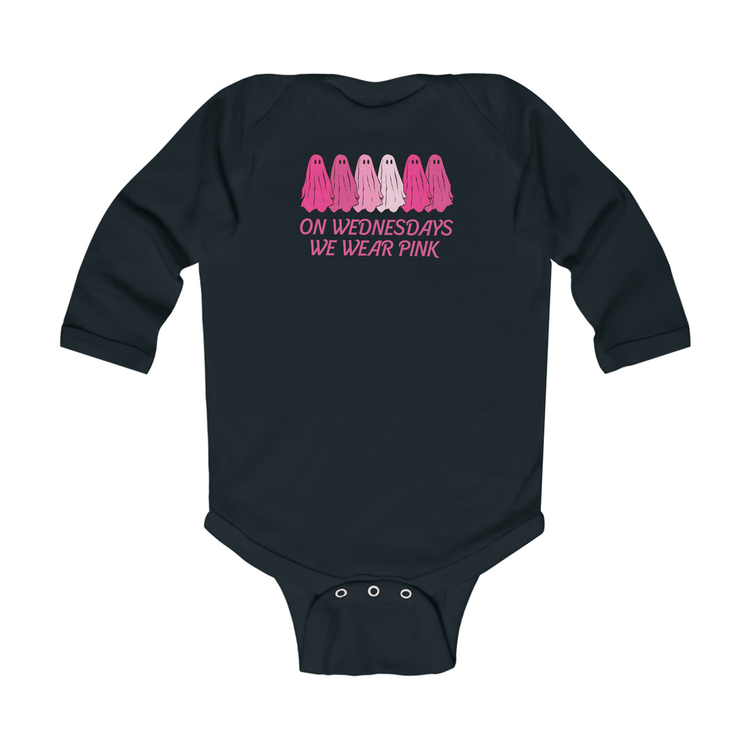 Black baby bodysuit with pink text, featuring On Wednesday's We Wear Pink design. Soft 100% combed ring-spun cotton, ribbed bindings, and plastic snaps for easy changing. From Worlds Worst Tees.