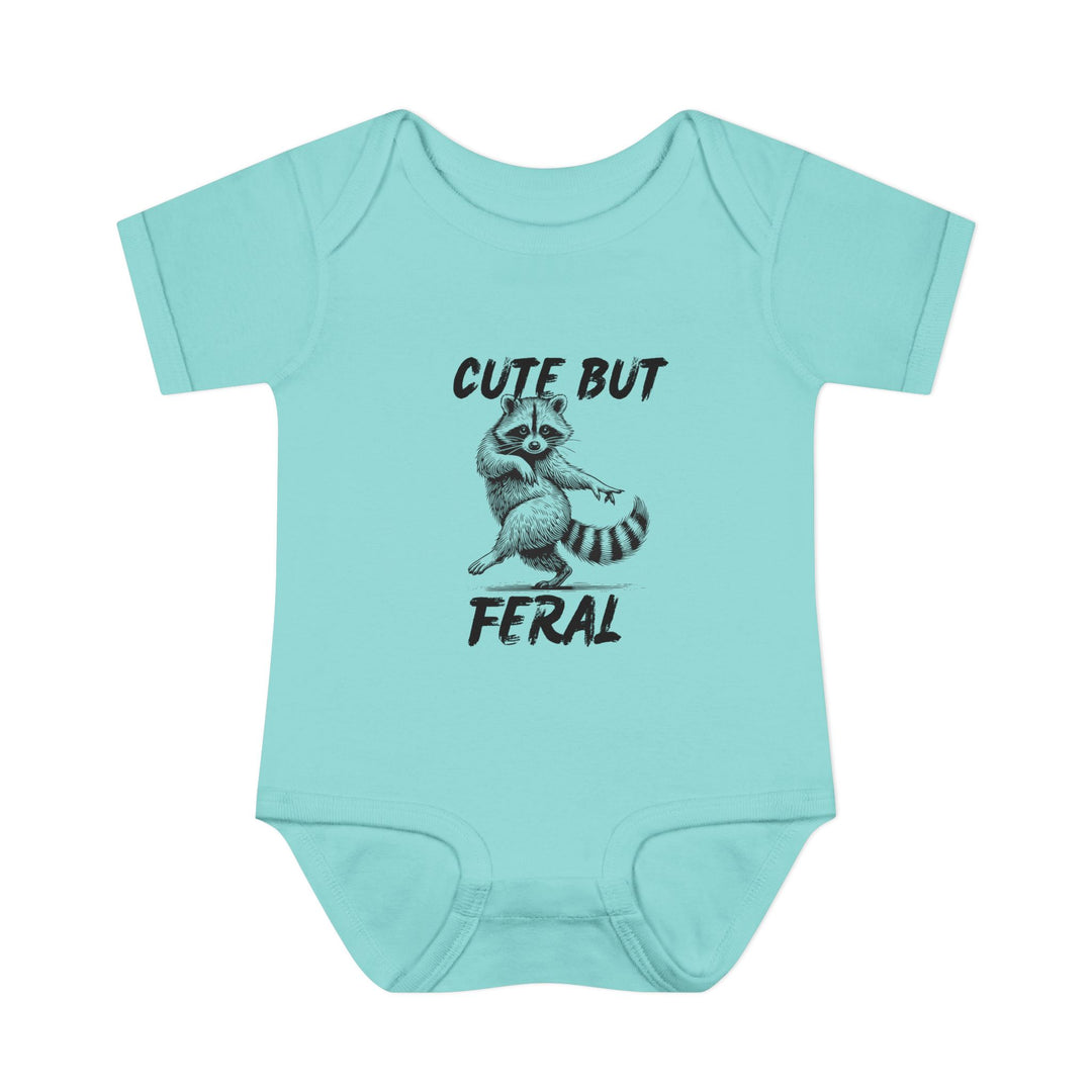 Light teal onesie features a sassy raccoon graphic with Cute But Feral slogan, ideal for infants. Soft, ring-spun cotton ensures comfort.