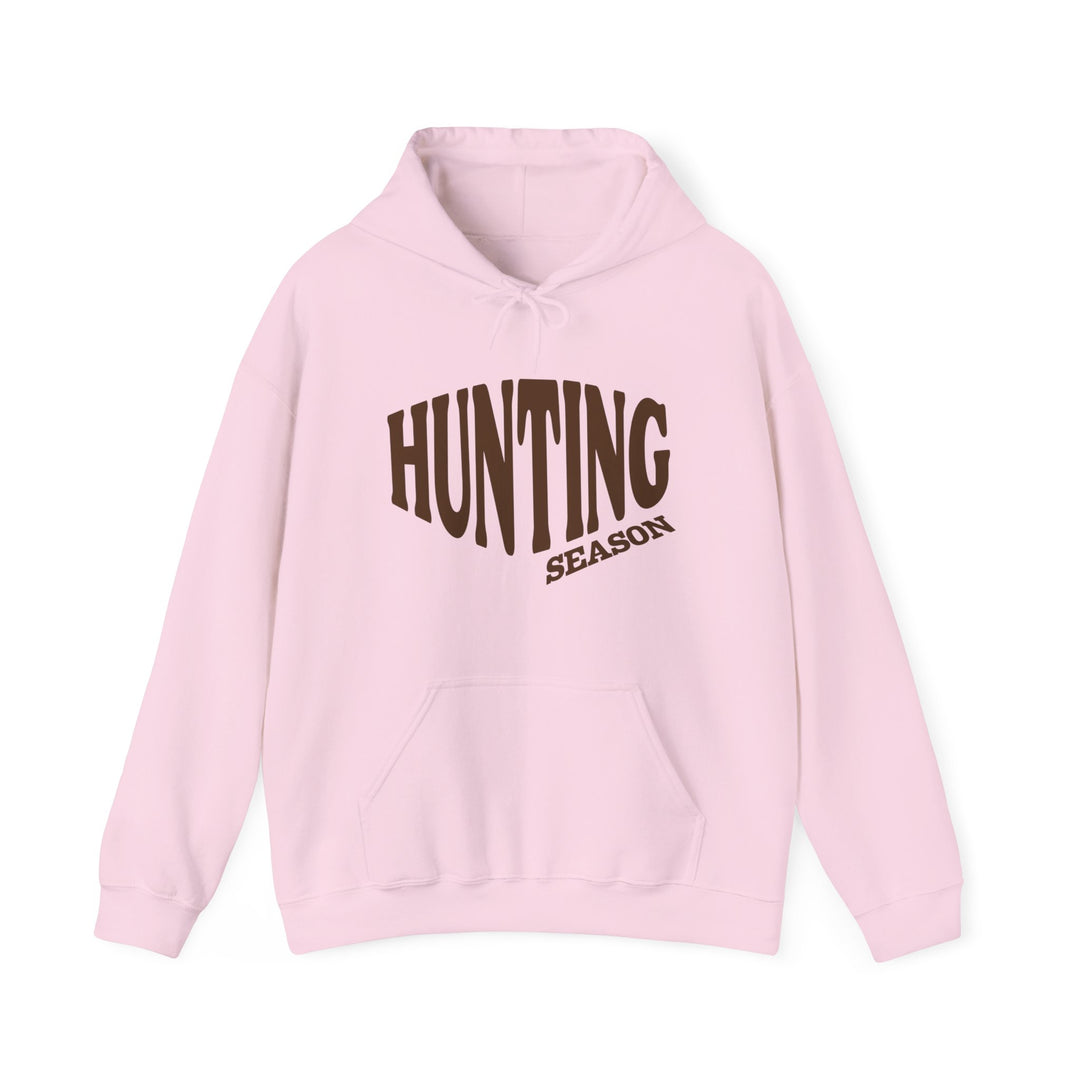 Light pink Hunting Season hoodie with kangaroo pocket and drawstring hood, offering a cozy blend of cotton and polyester for warmth and comfort.