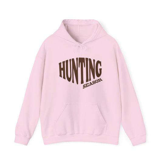 Light pink Hunting Season hoodie with kangaroo pocket and drawstring hood, offering a cozy blend of cotton and polyester for warmth and comfort.