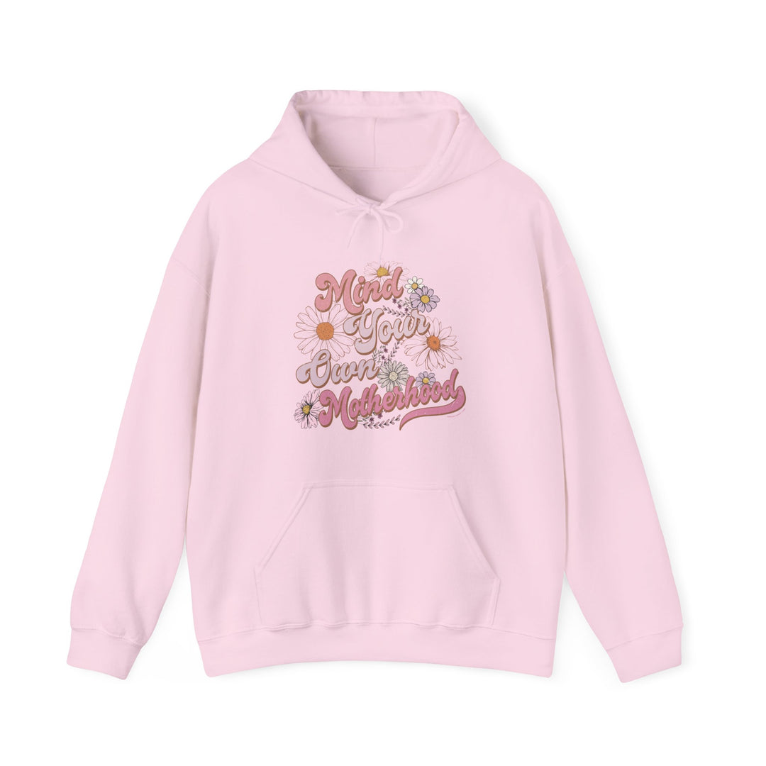 A pink Mind Your Motherhood Hoodie sweatshirt with kangaroo pocket and drawstring hood. Unisex heavy blend for warmth and comfort. Perfect for cold days. Sizes from S to 5XL.