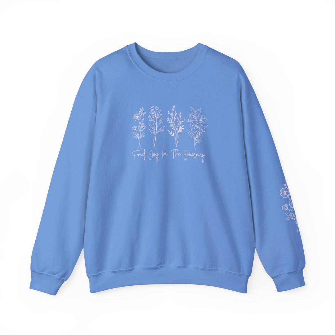 A unisex heavy blend crewneck sweatshirt, Find Joy in the Journey Crew, with white text and floral design. Made of 50% cotton, 50% polyester, ribbed knit collar, no itchy side seams, loose fit.