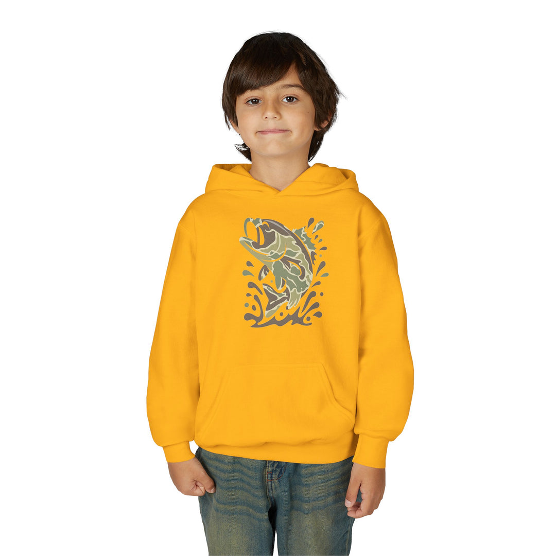 Young boy wearing a Camo Fish Youth Hoodie featuring a stylized jumping fish design. The hoodie is bright, with ultra-soft fleece, and includes a kangaroo pocket.