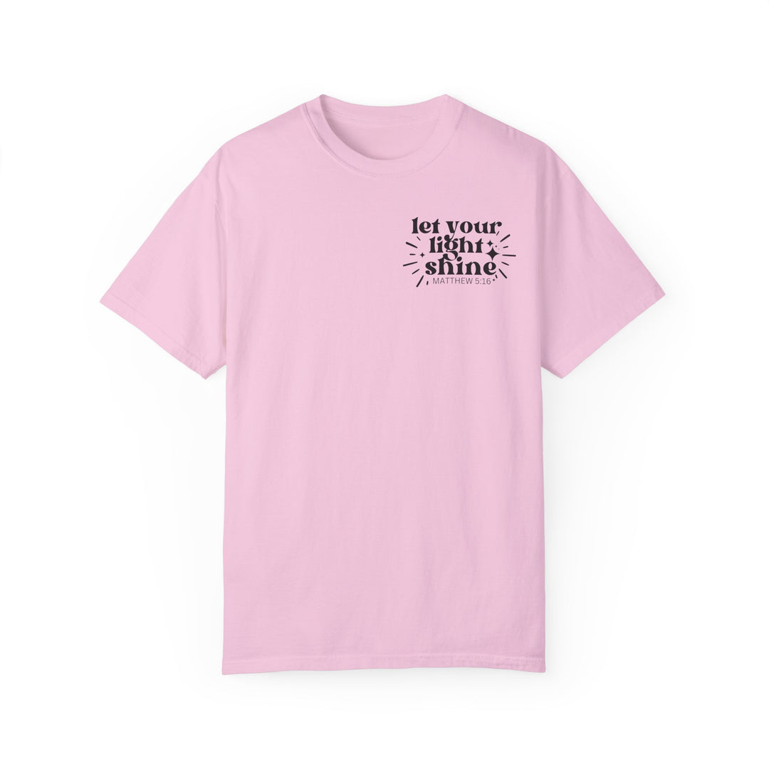 Relaxed fit Let Your Light Shine Tee, pink shirt with black text. 100% ring-spun cotton, medium weight, durable double-needle stitching, no side-seams for tubular shape.