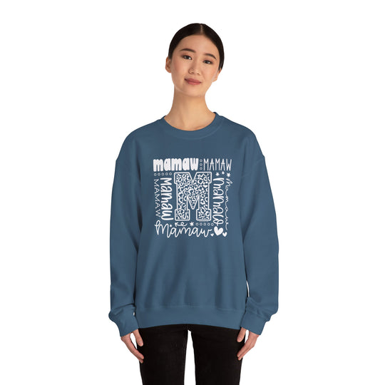 A cozy Mamaw Crew unisex sweatshirt in blue with white text, made from 50% cotton and 50% polyester blend for comfort and durability. Ideal for colder months, featuring a ribbed knit collar and double-needle stitching.