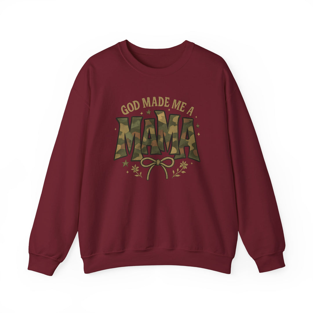 Burgundy-red crewneck sweatshirt with GOD MADE ME A MAMA printed, featuring camouflage-style MAMA and decorative elements, embodying comfort and style from Worlds Worst Tees.