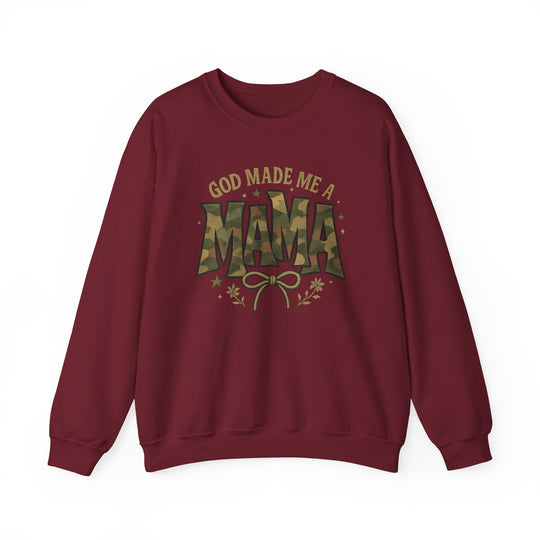 Burgundy-red crewneck sweatshirt with GOD MADE ME A MAMA printed, featuring camouflage-style MAMA and decorative elements, embodying comfort and style from Worlds Worst Tees.