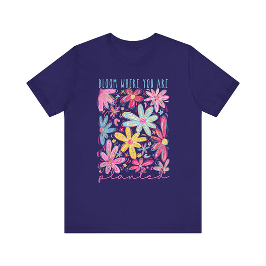 Unisex jersey short sleeve tee with Bloom Where You Are Planted design, featuring soft cotton, ribbed knit collars, and tapered shoulders for a comfortable fit.