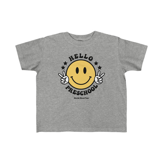 Hello Preschool Toddler Tee featuring a grey t-shirt with a yellow smiley face and peace sign hand gesture. Made of 100% combed ringspun cotton, light fabric, tear-away label, and a classic fit.