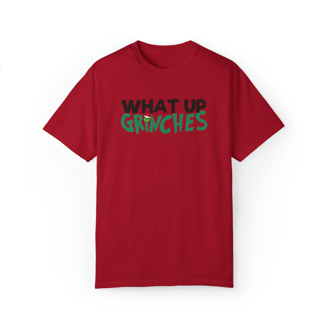 Unisex What up Grinches Tee, garment-dyed sweatshirt in red with black text. Made of 80% ring-spun cotton, 20% polyester, relaxed fit, rolled-forward shoulder, and back neck patch. Sizes S to 4XL.