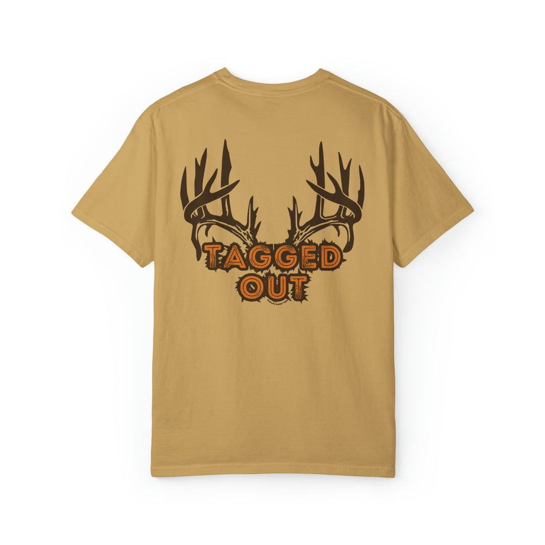 A tan shirt featuring antlers, the Tagged Out Tee by Worlds Worst Tees. Unisex, garment-dyed sweatshirt with 80% ring-spun cotton, 20% polyester, relaxed fit, and rolled-forward shoulder.