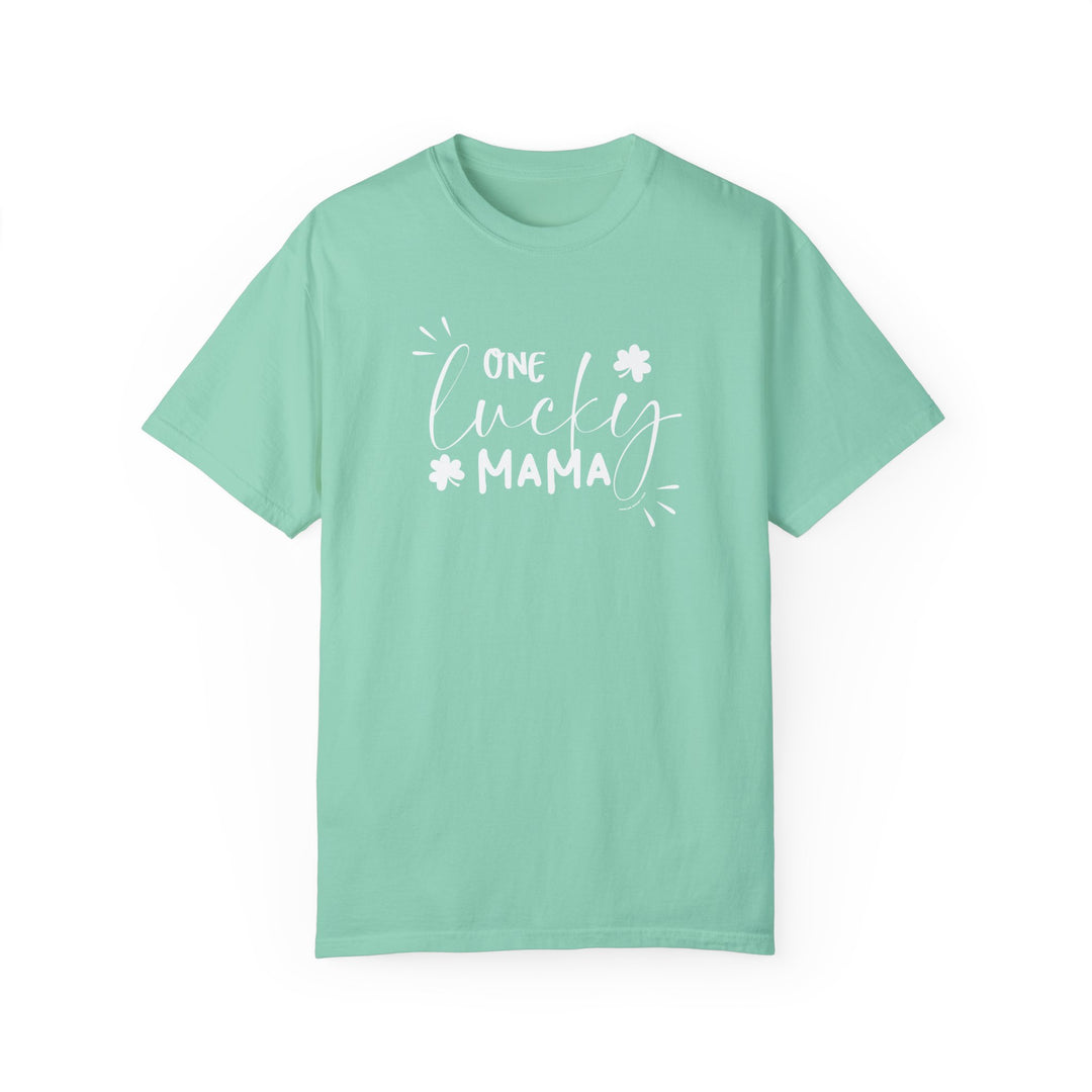 A relaxed fit One Lucky Mama Tee, garment-dyed in green with white text. Made of 100% ring-spun cotton for durability and coziness. No side-seams for a tubular shape.