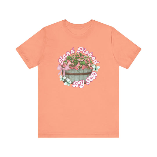 Unisex jersey short sleeve tee with Hand Picked by GOD graphic, featuring a crew neckline and ribbed knit collars for a classic, comfortable fit.