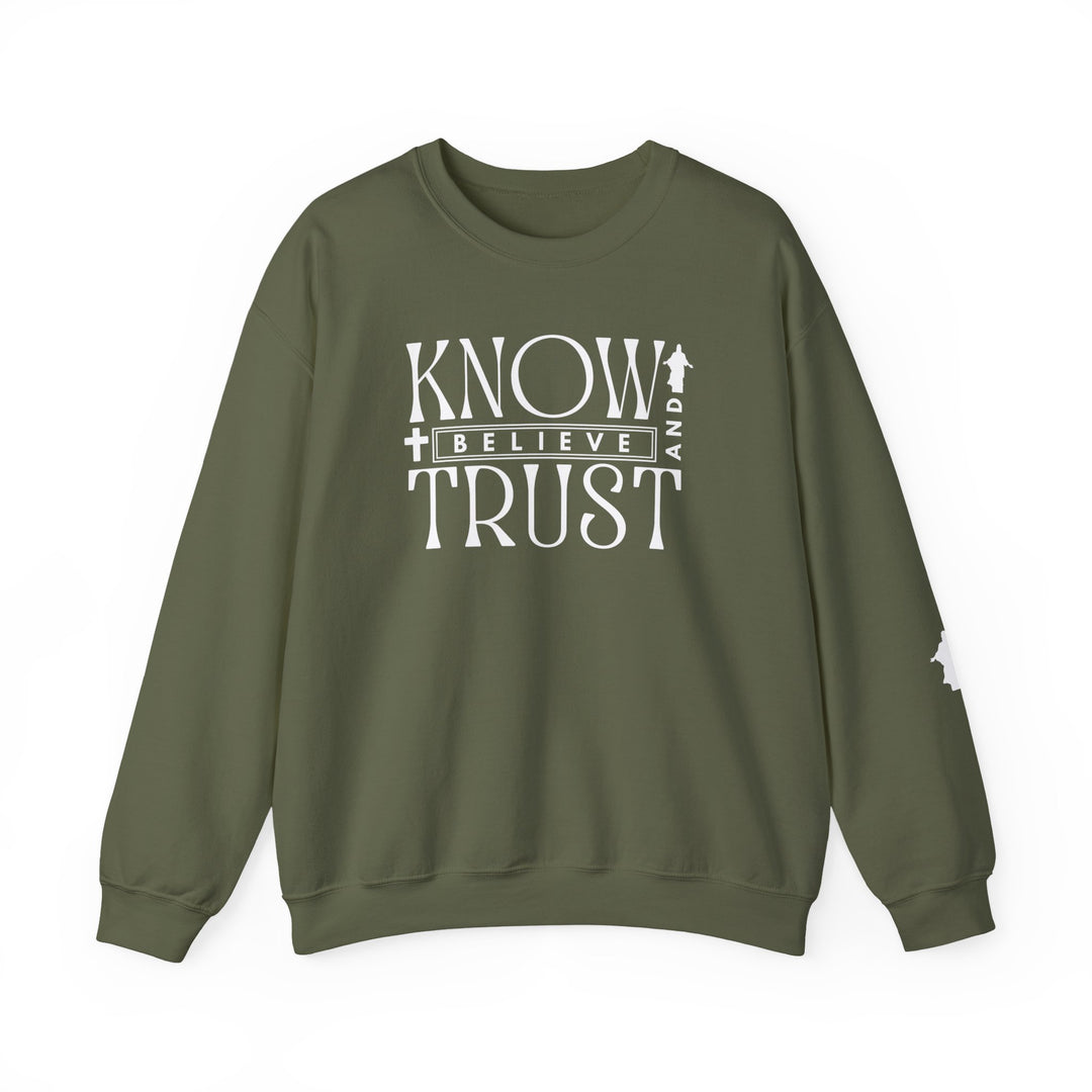 Green crewneck sweatshirt with white Trust, Know, Believe text, featuring a classic fit, ribbed collar, and durable stitching, ideal for casual comfort.