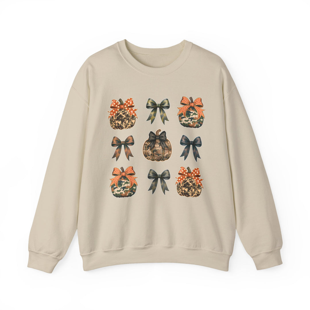 Bows and Pumpkins Crew: Light-beige sweatshirt with a 3x3 grid of camo and leopard-print pumpkins and bows, offering cozy comfort with durable, sustainable fabric.
