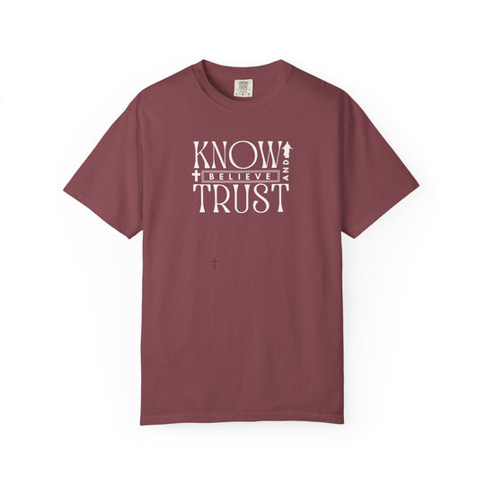 Know, Trust, Believe Tee from Worlds Worst Tees features bold white text on a red shirt, emphasizing comfort with a relaxed fit and durable stitching.