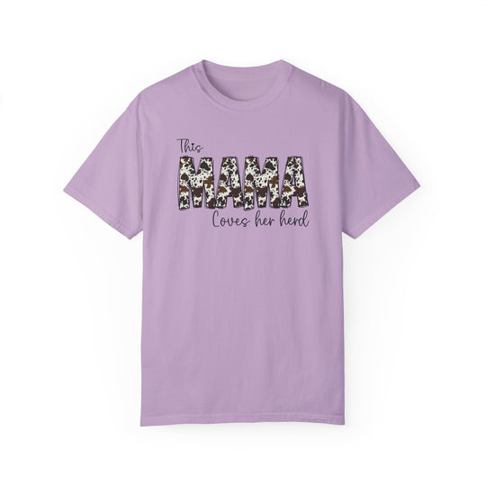 A relaxed fit Mama Herd Tee, a garment-dyed purple t-shirt with black text. Made of 100% ring-spun cotton for coziness, featuring double-needle stitching and no side-seams for durability and shape retention.