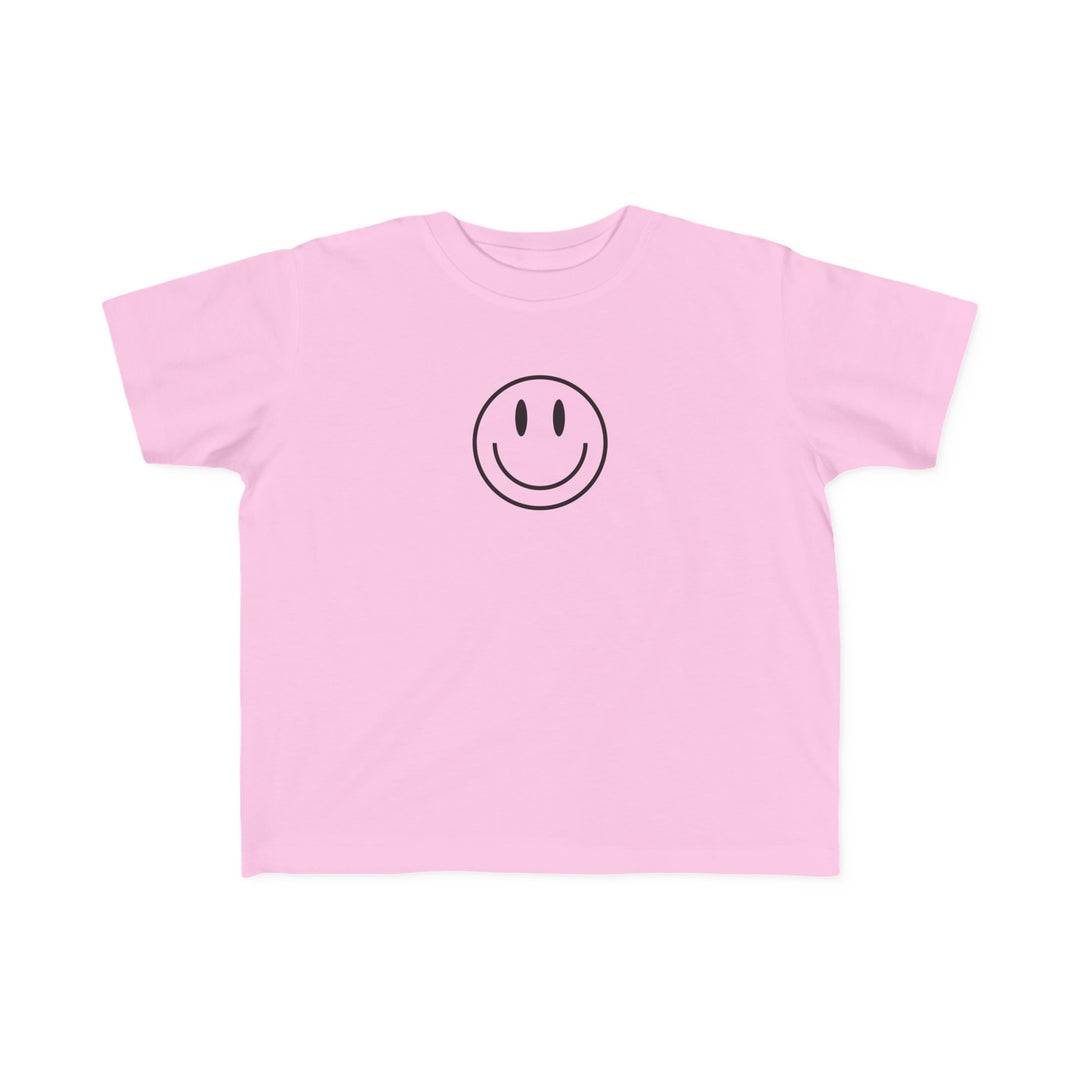 Toddler tee with a smiley face print, ideal for sensitive skin. Made of 100% combed ring spun cotton, light fabric, tear-away label, and a classic fit. Good Day to Have a Good Day Toddler Tee.