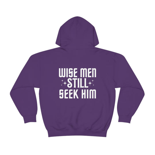 A Wise Men Still Seek Him Hoodie in purple, featuring white text. Unisex heavy blend, cotton-polyester fabric for warmth and comfort. Kangaroo pocket, drawstring hood, tear-away label. Classic fit, true to size.