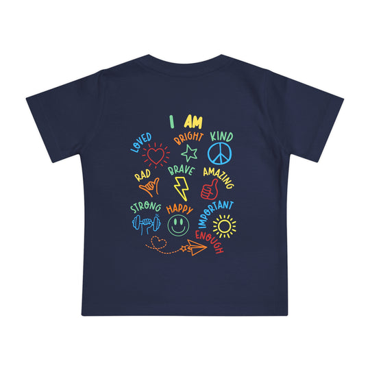Navy-blue I AM Baby Tee with multicolored graphic, featuring upbeat, self-affirming messages like LOVED, BRAVE, and STRONG surrounding central I AM statement.
