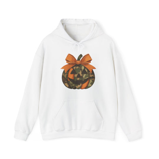 Copy of Jackie O Hoodie featuring a camouflage-patterned jack-o-lantern with an orange bow on a white pullover, perfect for a cozy, stylish look.