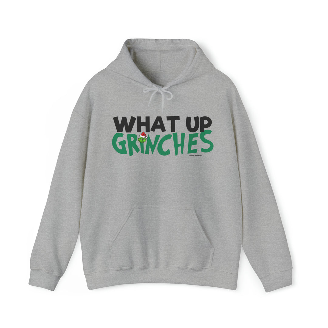 A cozy unisex heavy blend hooded sweatshirt featuring What up Grinches text. Made of 50% cotton, 50% polyester, with a kangaroo pocket and drawstring hood. Classic fit, tear-away label, runs true to size.