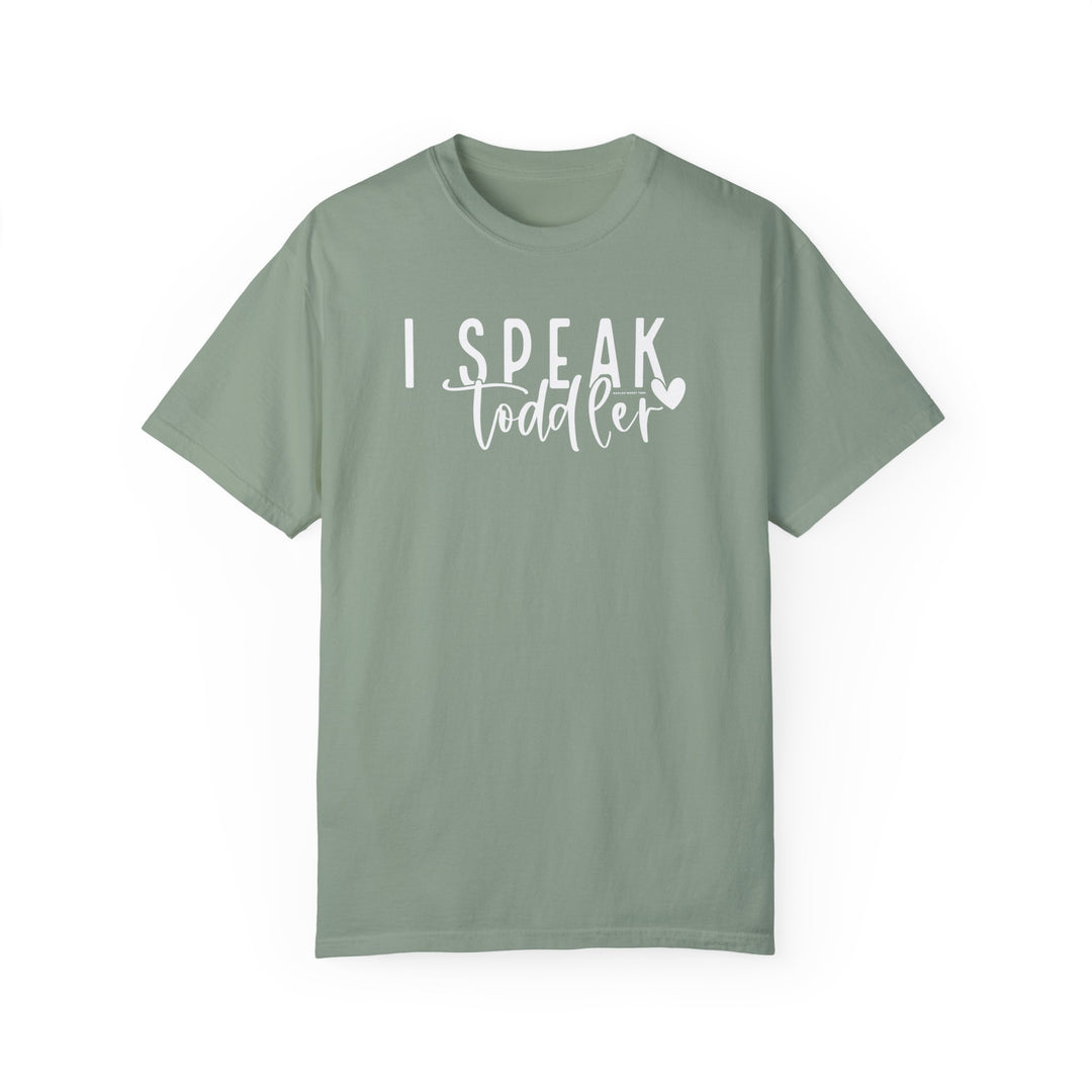 A cozy I Speak Toddler Tee in green with white text. 100% ring-spun cotton, garment-dyed, relaxed fit, and durable double-needle stitching. From Worlds Worst Tees.