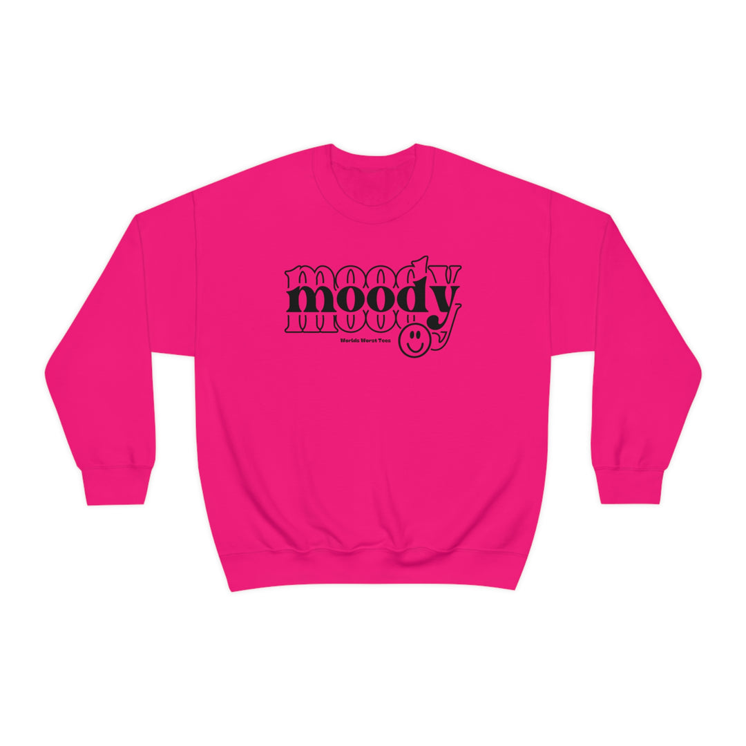 A unisex Moody Crew heavy blend sweatshirt in pink with black text. Features ribbed knit collar, no itchy side seams, 50% cotton, 50% polyester, loose fit, and medium-heavy fabric. Ideal for comfort.