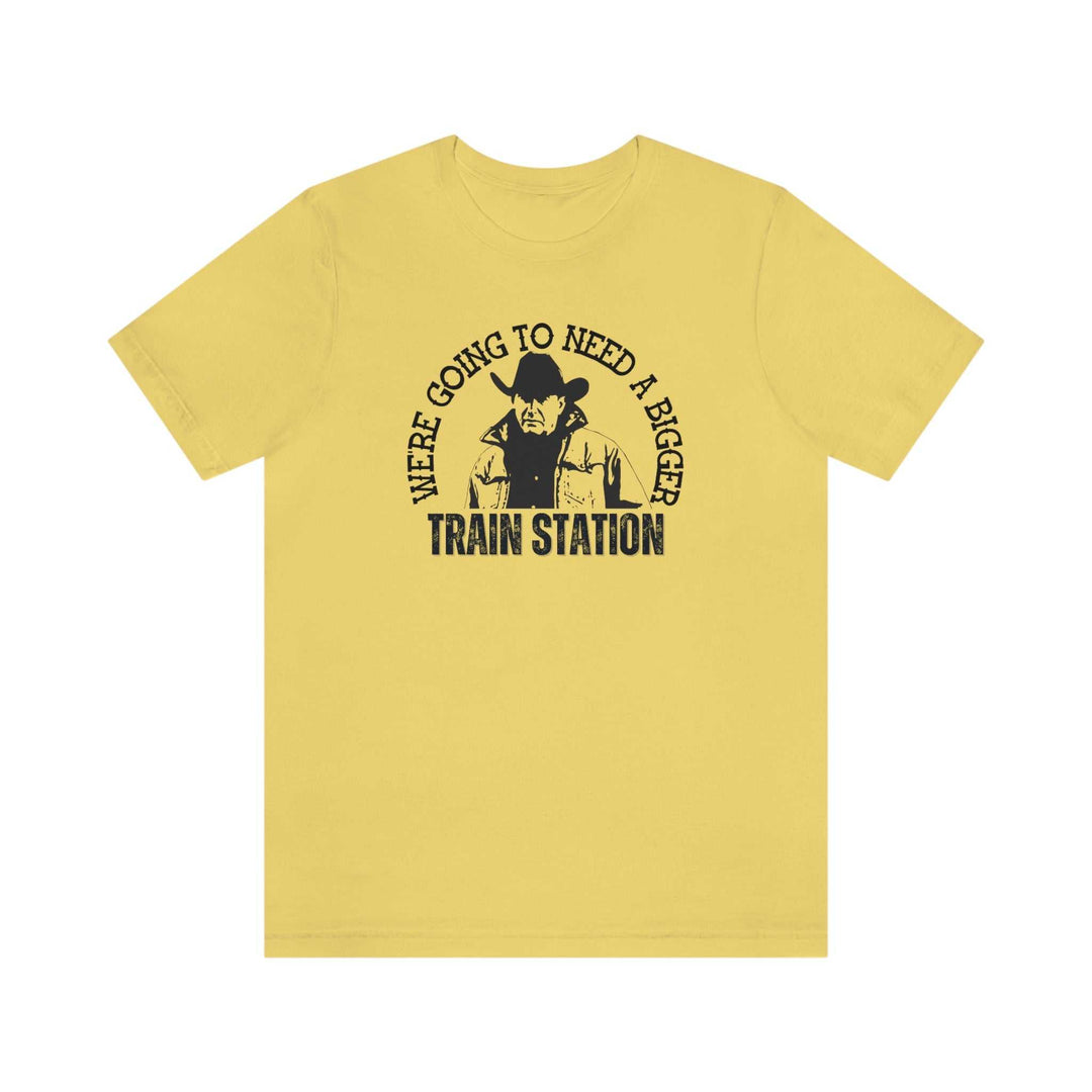 Men's premium fitted yellow t-shirt with black text featuring a cowboy design. Comfy, light, and roomy fit with ribbed knit collar. Ideal for workouts or daily wear. From Worlds Worst Tees.