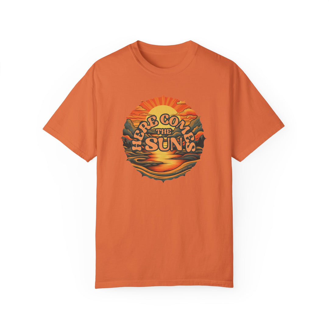 A relaxed fit Here Comes The Sun Tee, a garment-dyed t-shirt in orange with a graphic design. Made of 100% ring-spun cotton for coziness and durability. No side-seams for a tubular shape.