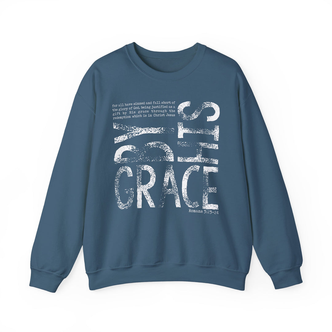 Blue crew-neck sweatshirt with BY GRACE and Romans 3:23-24 printed in white. Made from polyester-cotton blend, ideal for comfort and durability.