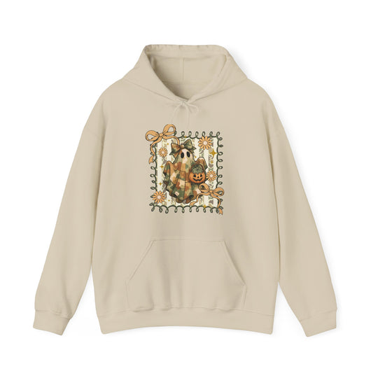 Light-beige Quilted Ghost Hoodie featuring a ghost in a plaid blanket with a jack-o’-lantern, framed by vines, bows, and flowers on a striped background.