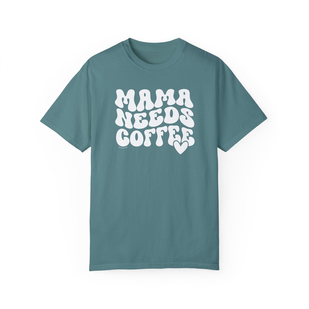 A relaxed-fit Mama Needs Coffee Tee, crafted from 100% ring-spun cotton. Garment-dyed for extra coziness, featuring double-needle stitching for durability and a seamless design for a tubular shape.